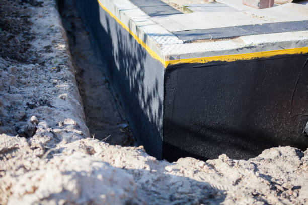 Professional Waterproofing technician working in Vernon, MI